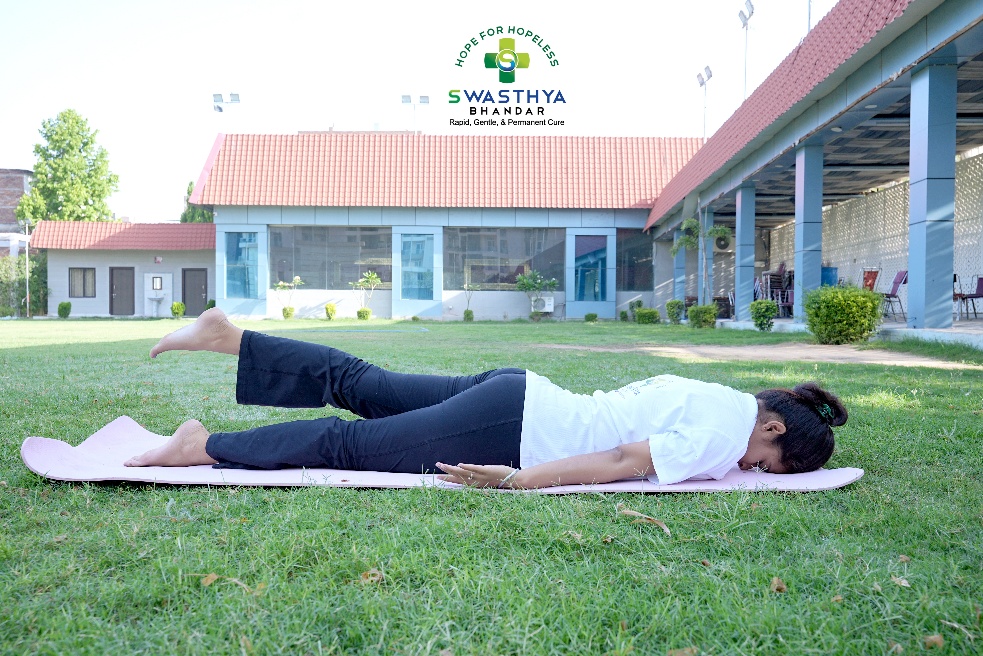 ARDH SHALBHASANA